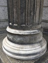 A Close Up Of The Base Of A Stone Column