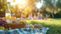 A close-up of a basket brimming with delicious picnic fare. In the softly blurred background, a family with children