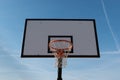 Close up basketball hoop, board or basket with blue sky in background. Royalty Free Stock Photo