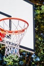 Close up of basketball hoop seen from below, blue sky background Royalty Free Stock Photo