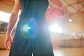 Close-up of basketball player holding ball on court Royalty Free Stock Photo