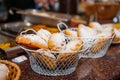 Close up baskets with freshly baked pastry goods on display in bakery shop. Selective focus Royalty Free Stock Photo