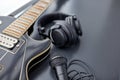 close up of bass guitar, microphone and headphones Royalty Free Stock Photo