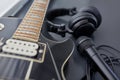 close up of bass guitar, microphone and headphones Royalty Free Stock Photo
