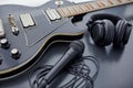 close up of bass guitar, microphone and headphones Royalty Free Stock Photo