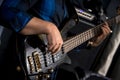 Close-up of bassist`s hands playing bass guitar Royalty Free Stock Photo