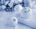 Close up bath balls, towel, flowers  on light background. Romantic spa concept Royalty Free Stock Photo