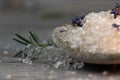 Close up of bath salts and lavender on wooden background Royalty Free Stock Photo