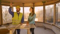 CLOSE UP: Bearded contractor shows the house under construction to investor.