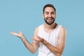 Close up bearded young man 20s years old perfect skin wearing white shirt isolated on blue pastel wall background Royalty Free Stock Photo