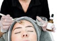 Close up of beautician cosmetologist applying chemical peel treatment on patient in a beauty spa, for skin rejuvenation,