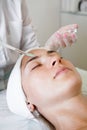 Close-up beautician doctor hand making anti-age procedure apply peeling acid Royalty Free Stock Photo