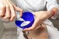 Close-up beautician doctor hand pouring white liquid peeling acid for anti-age procedure mask peel for young attractive Royalty Free Stock Photo