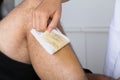 Beautician Waxing Man`s Leg Royalty Free Stock Photo