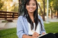 Close-up of beautiful asian female student listening to music, l Royalty Free Stock Photo