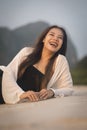 Close up of the beautiful asian women lying on the beach in the summer. Asian woman vacationing at the beach in the evening