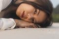 Close up of the beautiful asian women lying on the beach in the summer. Asian woman vacationing at the beach in the evening