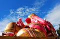 Close Up Beautiful Big Pink colors of Hindu god lord Ganesha with white cloud and blue sky background Royalty Free Stock Photo