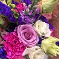 Spring bouquet of mixed colorful flowers. Flowers bouquet including white lisianthus, statica purple, pink roses, white roses, Royalty Free Stock Photo