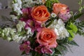 A Close up of A Beautiful Bouquet of Salmon Roses, White Snapdragons and Alstroemeria Flowers. Royalty Free Stock Photo