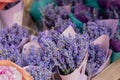 Close up: beautiful bouquets of purple lavender flowers in craft paper cornets