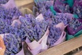 Close up: beautiful bouquets of purple lavender flowers in craft paper cornets