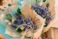 Close up: beautiful bouquets of purple lavender flowers in craft paper cornets