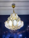 Close-up of a beautiful crystal chandelier Beautiful chandelier. luxury expensive chandelier hanging under ceiling. Royalty Free Stock Photo