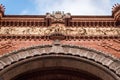 Close up on the beautiful details of the red triumphal arch of Barcelona