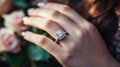 Close-up of beautiful diamond engagement ring on womans hand with copy space for text Royalty Free Stock Photo