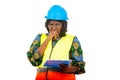 Close up of a beautiful female engineer with clipboard, pensive Royalty Free Stock Photo