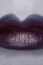 Close up of beautiful full woman lips with purple makeup Royalty Free Stock Photo