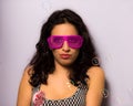 Close up of a beautiful girl with professional make-up blowing soap bubbles around her Royalty Free Stock Photo