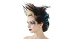 Close-up of beautiful gothic woman with spiked hair and face painting over white background Royalty Free Stock Photo