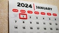 Close-up of a beautiful January page of the wall calendar 2024 with a red cursor on the New year\'s date
