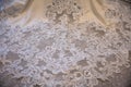 Close up of beautiful lace detail on a wedding dress train Royalty Free Stock Photo