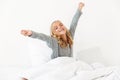 Close-up of beautiful little girl waking up with stretching arms Royalty Free Stock Photo