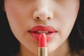 Close up beautiful luxury young woman applying lip liner to nude red lips Royalty Free Stock Photo