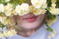 Close up of beautiful natural lips framed by yellow roses Royalty Free Stock Photo