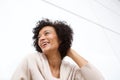 Close up beautiful older woman laughing with hand in hair Royalty Free Stock Photo