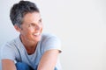 Close up beautiful older woman smiling against white background