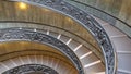 CLOSE UP: Beautiful ornate spiral staircase winding down empty historic museum.