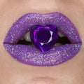 Close up beautiful purple violet lips with jewel