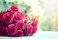 close up beautiful red roses bouquet with glowing light background for valentine day and love theme