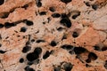 close-up of beautiful relief of an old stone with round holes in it Royalty Free Stock Photo