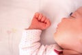 Close-up beautiful sleeping baby girl. Newborn baby girl, asleep on a blanket. Royalty Free Stock Photo