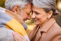 Beautiful smiling senior family couple husband and wife hugging   with love  in park on autumn day Royalty Free Stock Photo