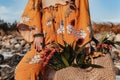 Close up of beautiful stylish boho model holding bag outdoors Royalty Free Stock Photo