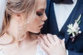 Close-up of beautiful wedding couple in park. They kiss and hug each other Royalty Free Stock Photo