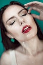 Close-up of beautiful wet woman face with water drop. On green b Royalty Free Stock Photo